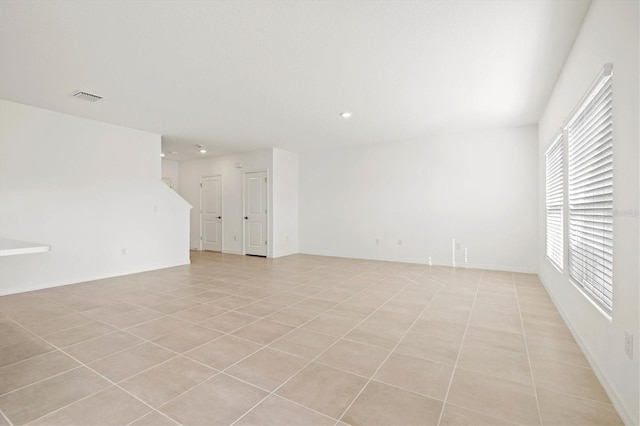 spare room with light tile patterned floors