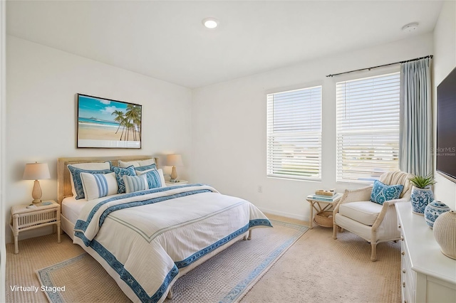 bedroom featuring light carpet