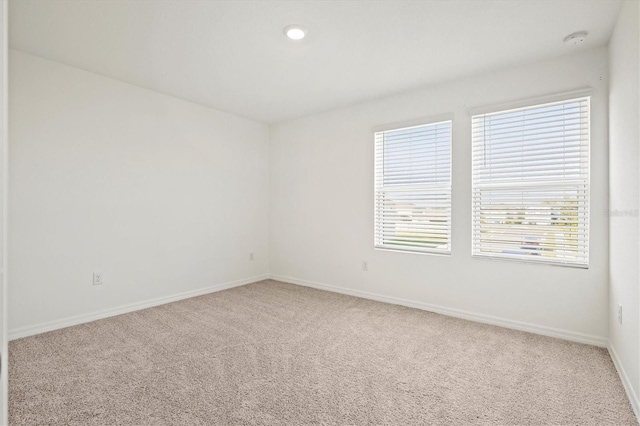 empty room with carpet flooring