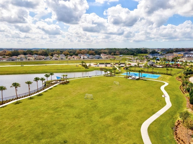 birds eye view of property featuring a water view