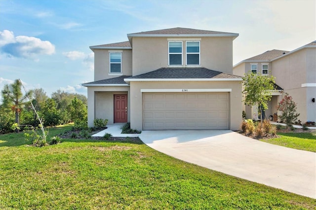 front of property featuring a garage and a front yard