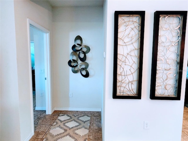 corridor featuring light tile patterned flooring