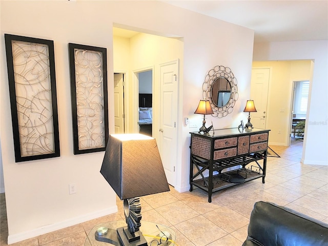 corridor featuring light tile patterned flooring