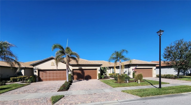 single story home featuring a garage