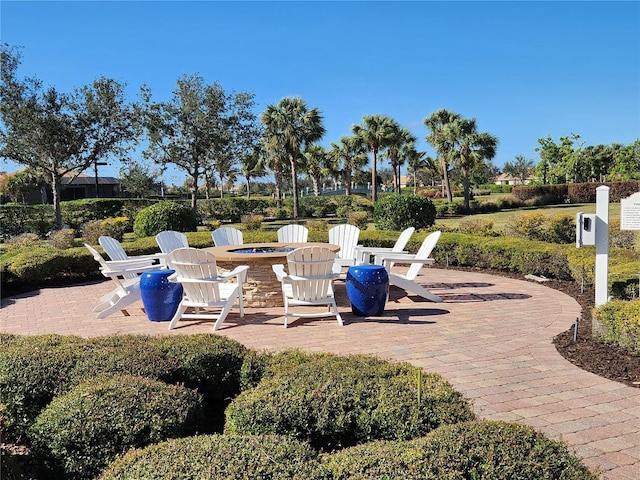 view of patio / terrace with an outdoor fire pit