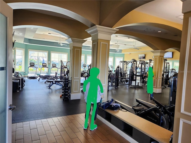 workout area featuring decorative columns