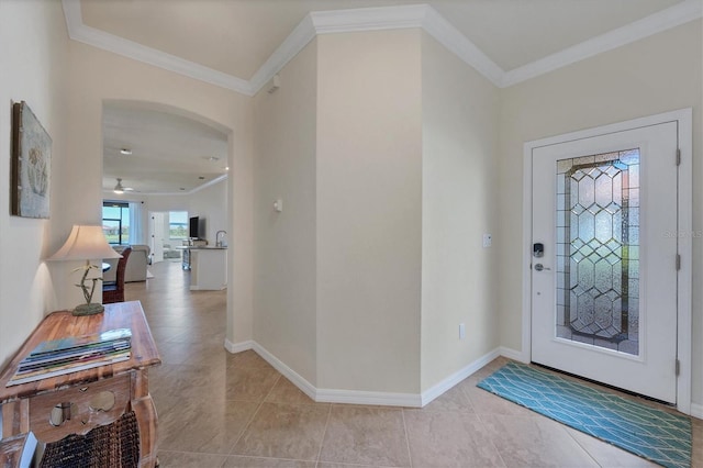 tiled entryway featuring crown molding