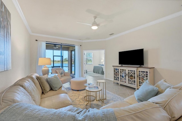 tiled living room featuring ceiling fan and ornamental molding