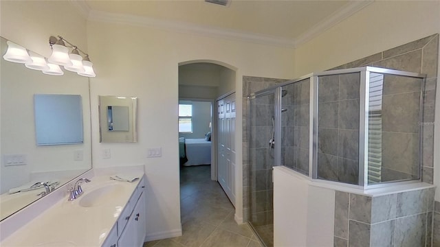 bathroom with crown molding, vanity, tile patterned floors, and a shower with shower door