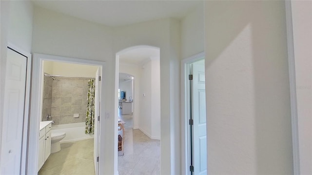 corridor featuring light tile patterned floors