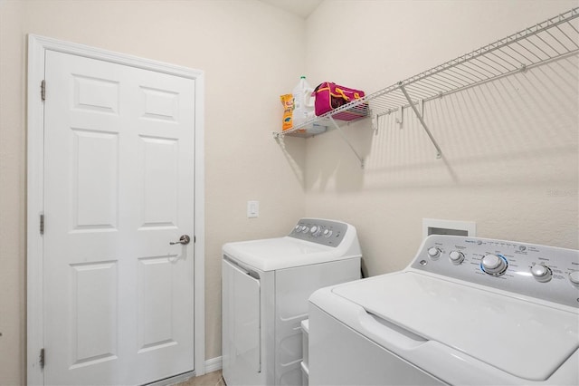 washroom featuring washing machine and dryer