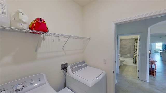 laundry area with washing machine and clothes dryer