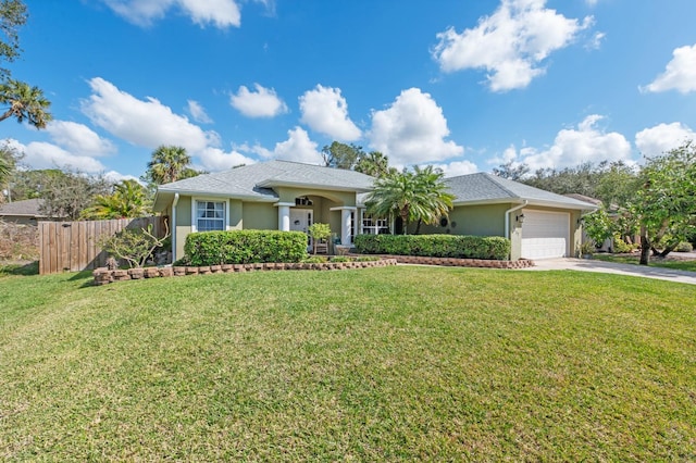 ranch-style house with a garage and a front yard