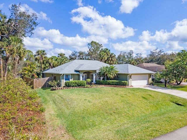 single story home featuring a garage and a front lawn