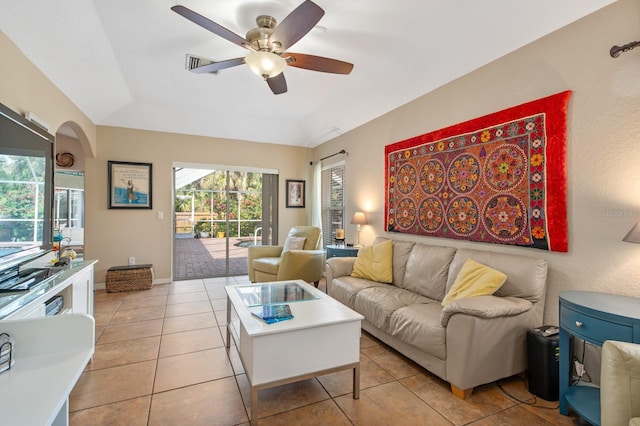 tiled living room featuring ceiling fan