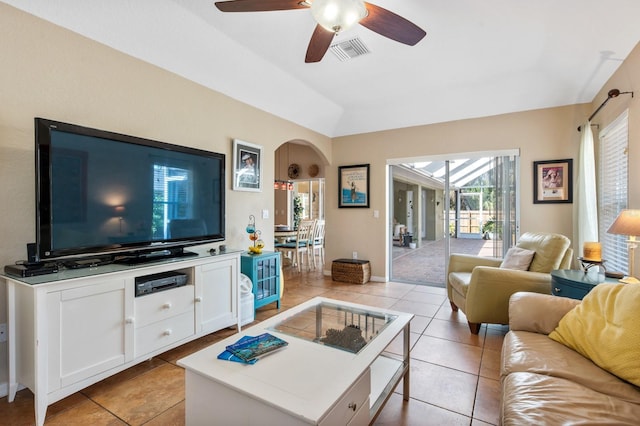 living room with vaulted ceiling, light tile patterned floors, and ceiling fan