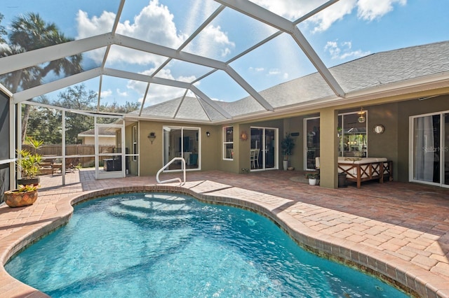 view of pool featuring a lanai and a patio area