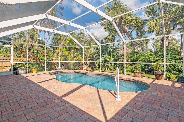 view of pool featuring a lanai and a patio