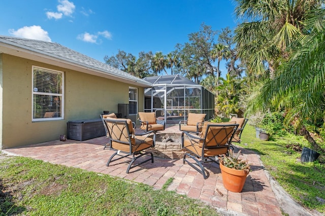 view of patio / terrace featuring outdoor lounge area and a lanai