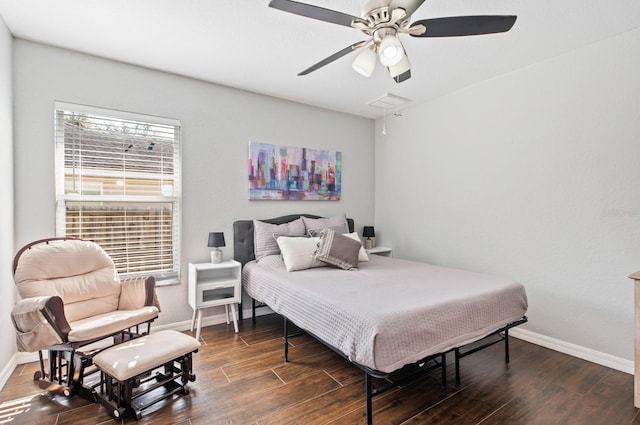 bedroom with dark hardwood / wood-style floors and ceiling fan