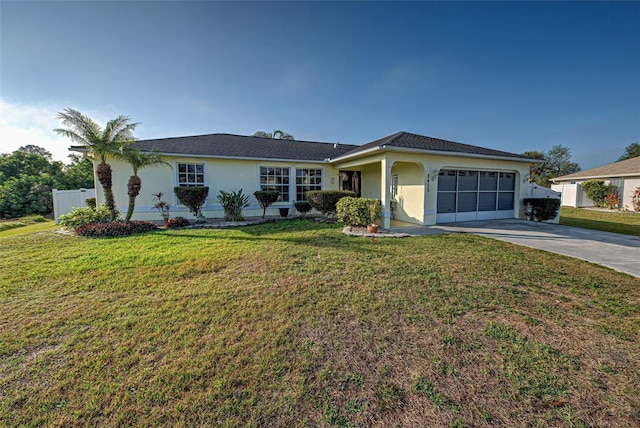 ranch-style house with a garage and a front yard