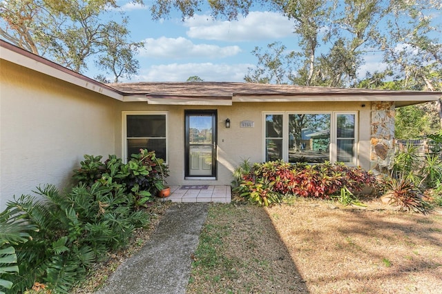 entrance to property with a yard