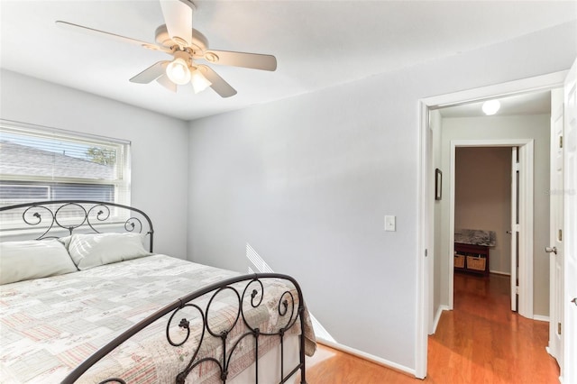 bedroom featuring ceiling fan and hardwood / wood-style floors