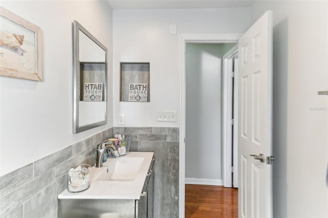 bathroom with vanity and wood-type flooring