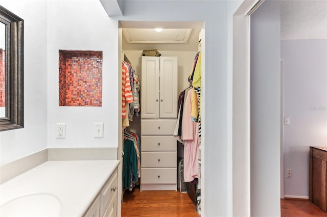 bathroom with vanity and hardwood / wood-style floors