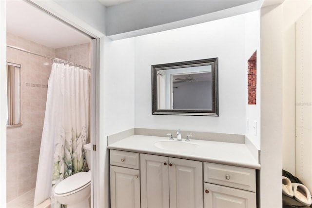 bathroom with walk in shower, vanity, and toilet