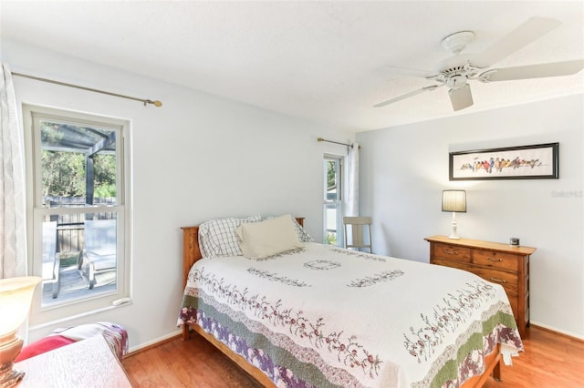 bedroom with hardwood / wood-style floors and ceiling fan