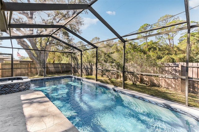 view of swimming pool with a patio area and glass enclosure