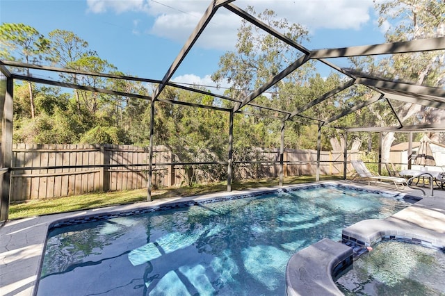 view of swimming pool with a lanai and a patio area