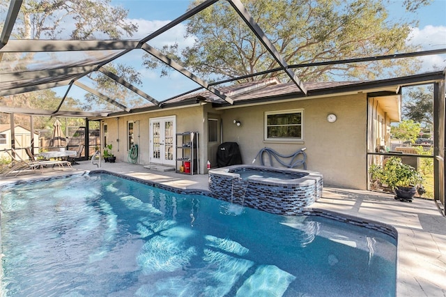 view of swimming pool featuring an in ground hot tub, a patio area, and french doors