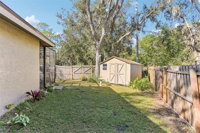 view of yard featuring a storage unit