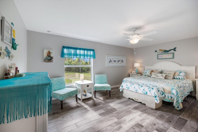 bedroom with ceiling fan and wood-type flooring