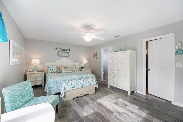 bedroom featuring ceiling fan and dark hardwood / wood-style flooring