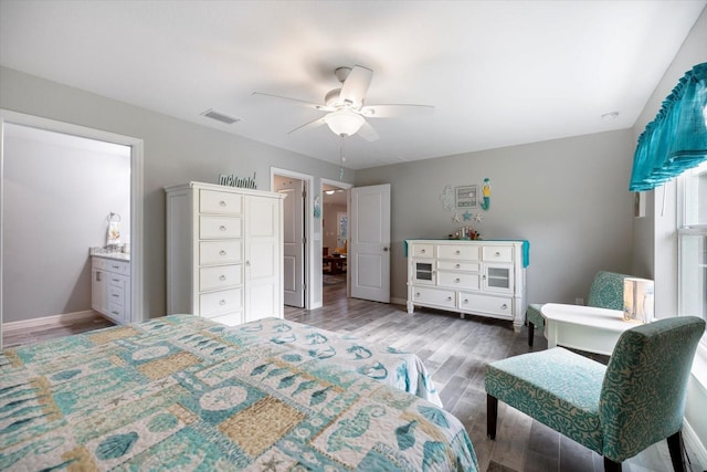 bedroom with ceiling fan and dark hardwood / wood-style floors