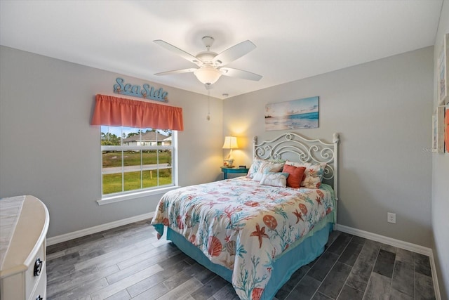 bedroom featuring ceiling fan and dark hardwood / wood-style floors