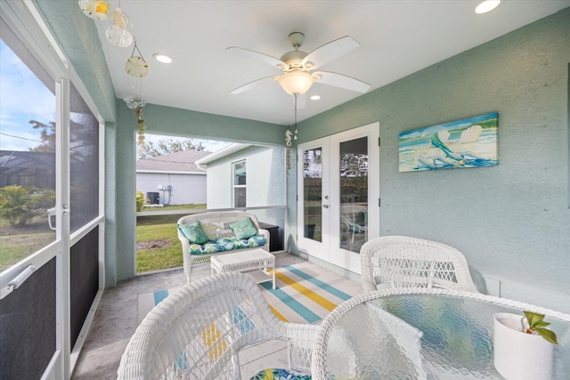 sunroom featuring french doors and ceiling fan