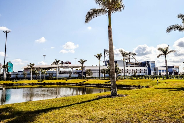 exterior space with a water view and a yard