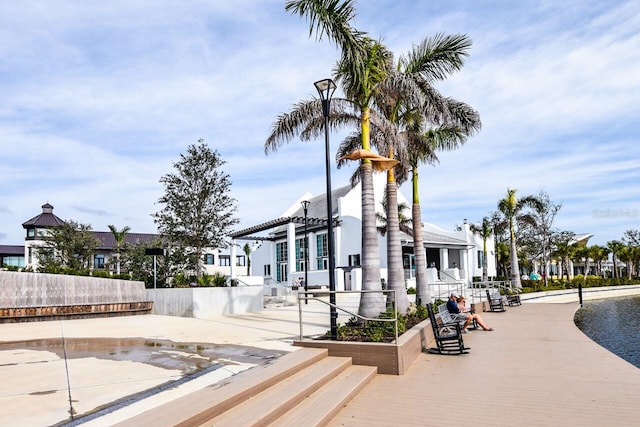 view of community with a pergola and a patio area