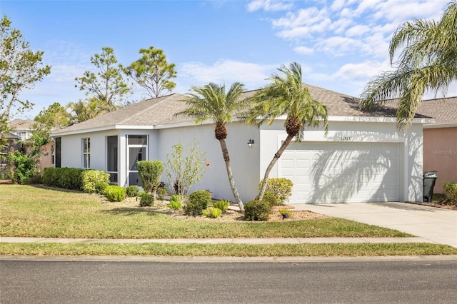 view of side of property featuring a garage and a lawn