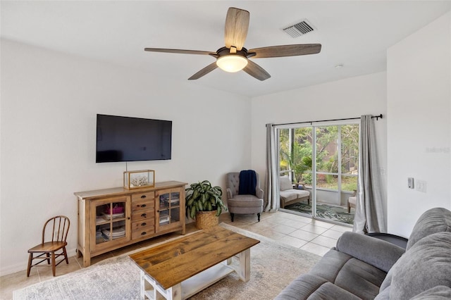 living room featuring ceiling fan and light tile patterned flooring