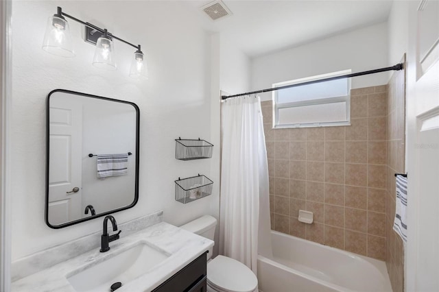 full bathroom featuring vanity, shower / tub combo, and toilet