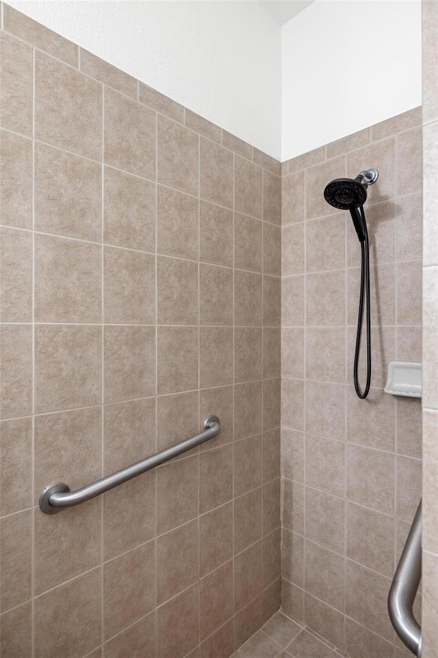 bathroom with tiled shower