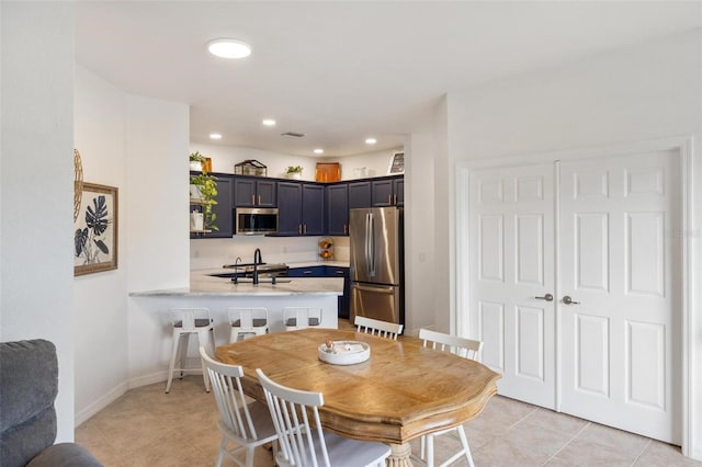 11915 Tempest Harbor Loop, Venice, FL 34292 - dining space with recessed lighting, baseboards, and light tile patterned floors