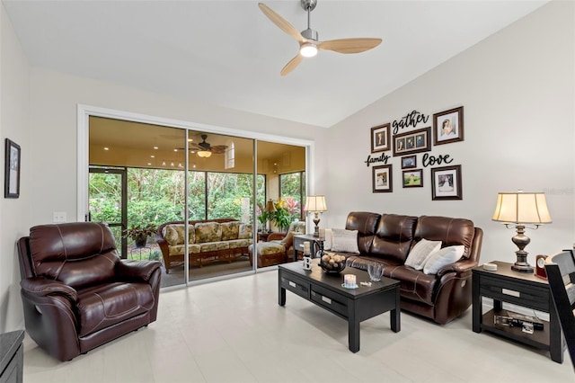 living room featuring ceiling fan and lofted ceiling