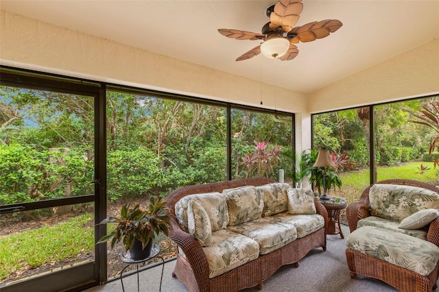 sunroom with lofted ceiling and ceiling fan