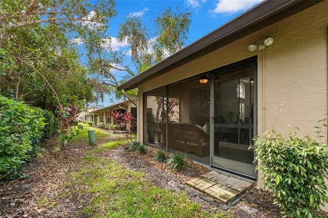 view of yard featuring a sunroom